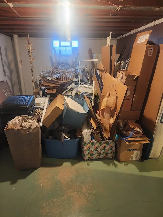 Roll-off dumpster container at job site for Yard Waste Dumpster Rental in Cleves