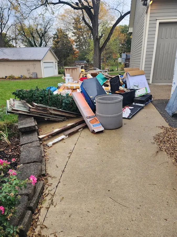 Dumpster being loaded with debris for Commercial Dumpster Rental in Cleves